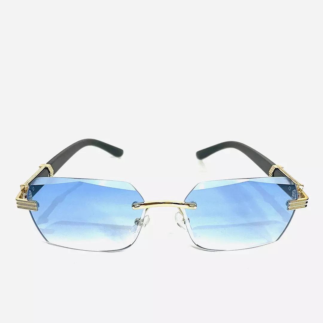 Óculos de sol Blue Lyss com lentes azuis degradê e armação dourada minimalista. Estilo moderno e sofisticado, ideal para compor looks únicos.